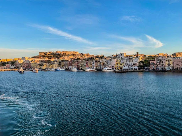 Marina Grande port in Procida island The Marina Grande port in Procida, colored old building view from the ferry boat from Naples