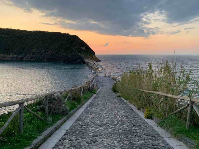 Vivara island bridge a stone pavement bridge with wooden parapets crosses the sea and connects Procida with the island of vivara